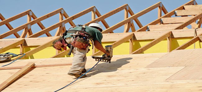 A man working on the roof of a building.